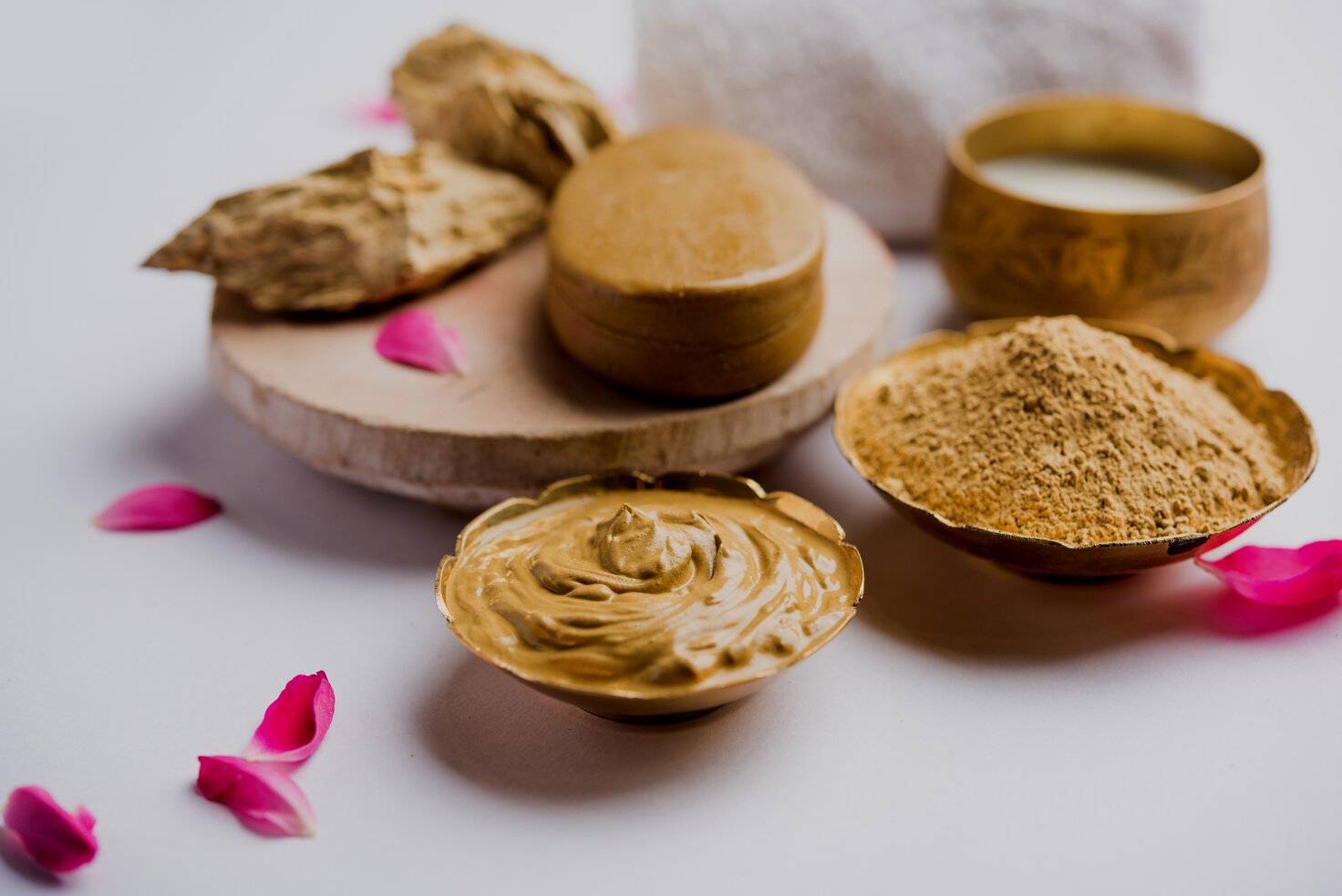 Herbal or Ayurvedic face Pack using Multani mitti, milk etc placed with Soap, towel. Selective focus